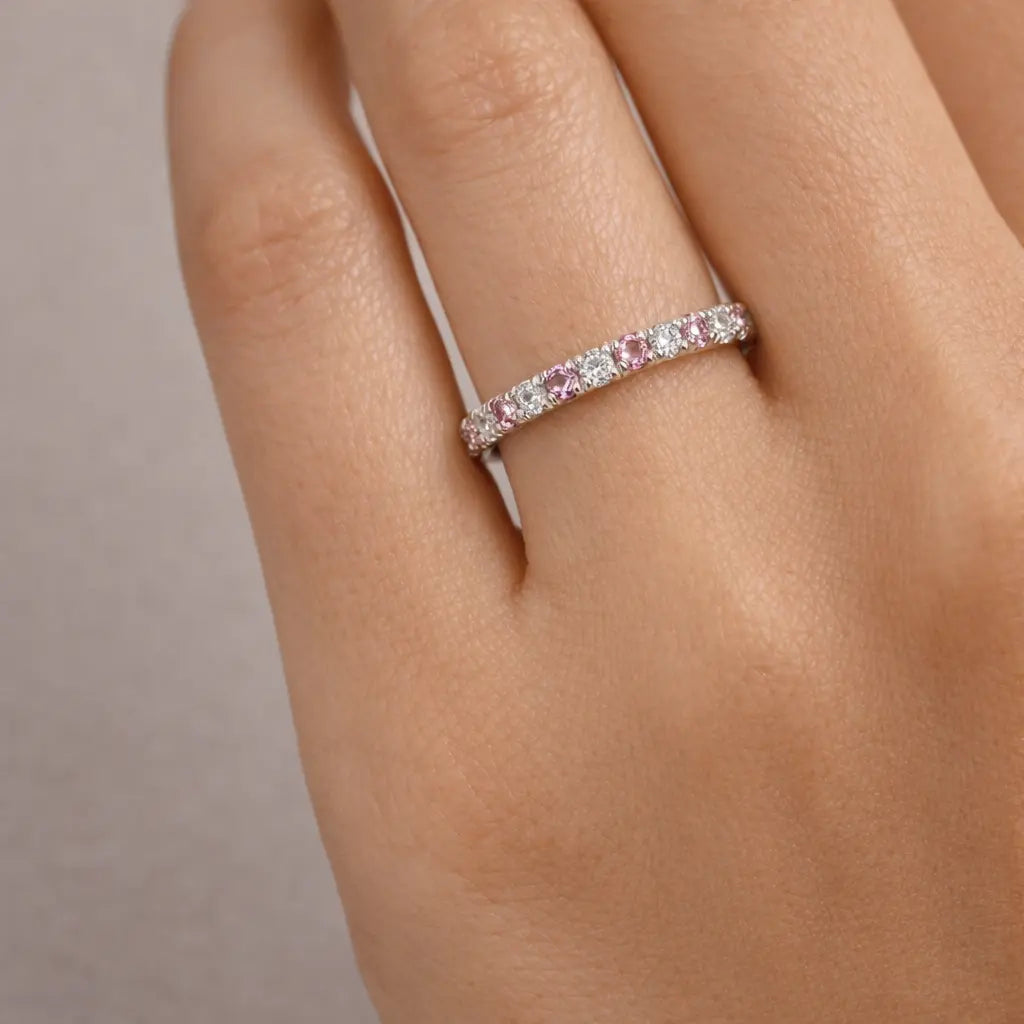 14k white gold pink sapphire and diamond eternity band worn on woman's hand stackable ring gift jewelry