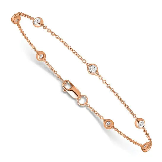 14K rose gold lab grown diamond bracelet angled view showing round bezel-style stations on white background