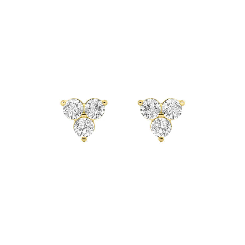 Pair of 1 1/2 ct IGI certified lab grown diamond three-stone cluster stud earrings in 14K yellow gold on white background