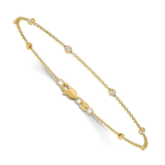 14K yellow gold lab grown diamond station bracelet angled view with lobster clasp on white background