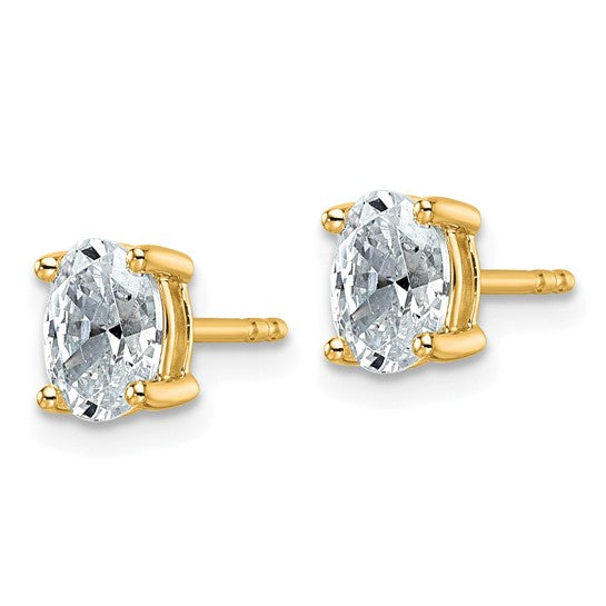Side profile of 14K yellow gold IGI certified lab grown diamond oval stud earring showing 4-prong setting on white background