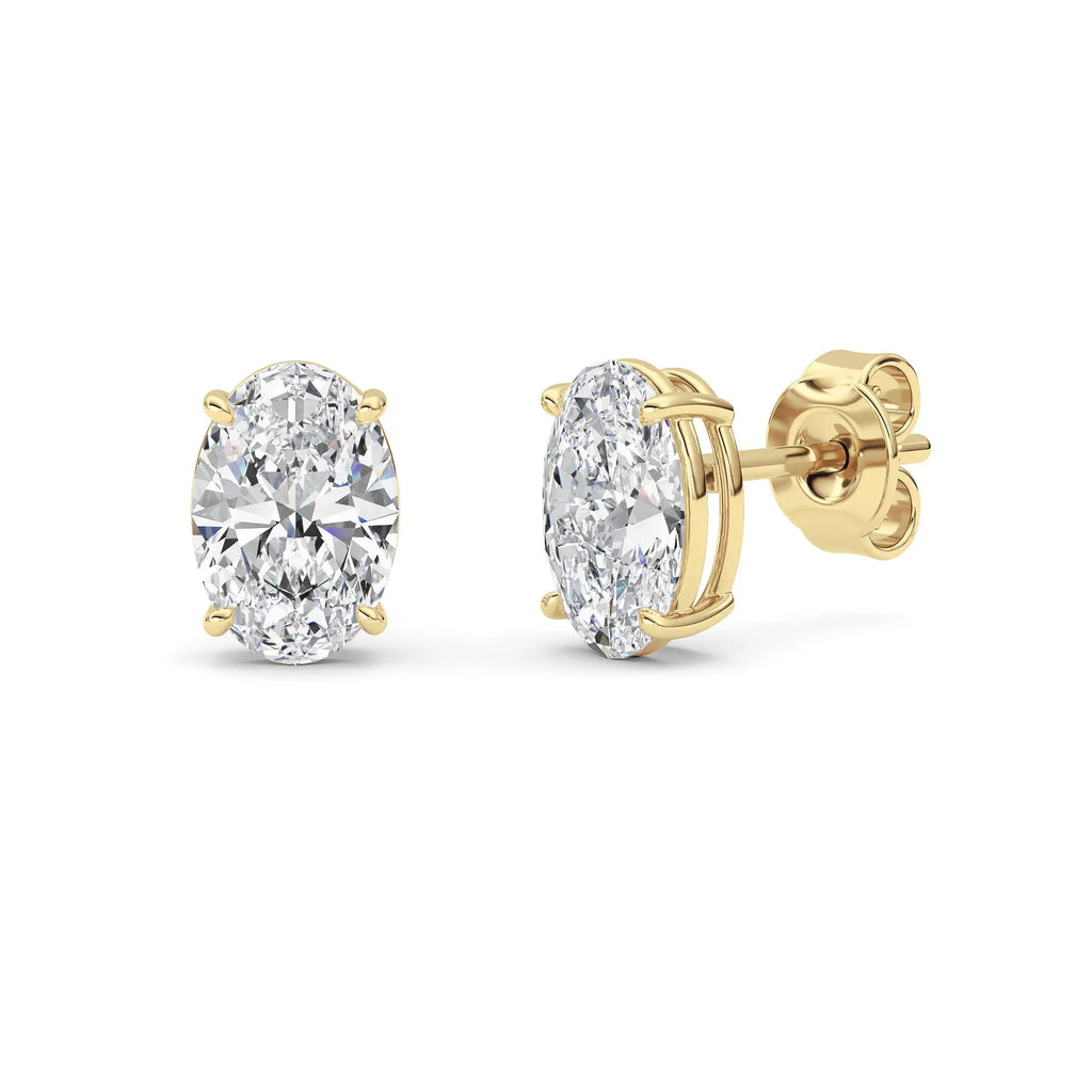14K yellow gold oval lab grown diamond stud earrings with 4-prong basket and push-back post on white background