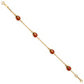 14K yellow gold rolo chain bracelet with four red and black enamel ladybug charms and spring ring clasp, 6.5 inches, on white background