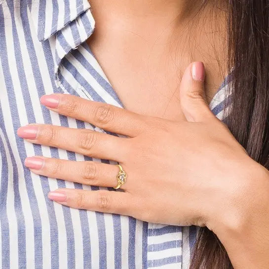 14K yellow and rose gold LOVE heart ring with rhodium accents worn on hand showing its petite scale