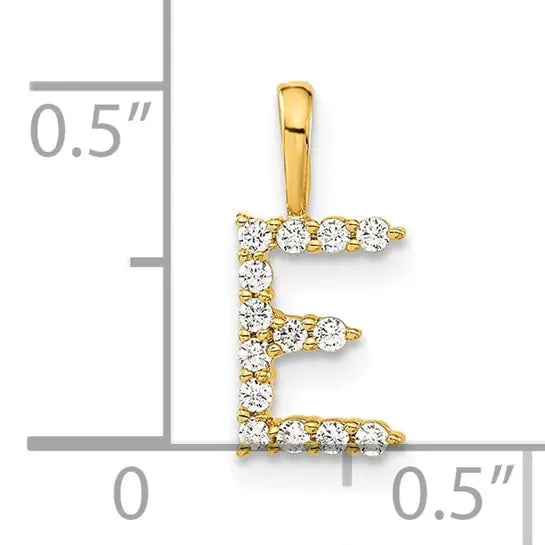 14K yellow gold 1/8 carat lab grown diamond initial E pendant shown beside inch scale on white background